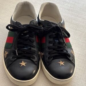 GUCCI (Authentic) Black Leather Sneakers with Red and Green Accents
